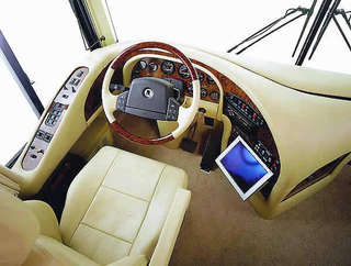 Illustration for article titled Luxury Caravan Has Sports Car Parking Dock In Its Belly